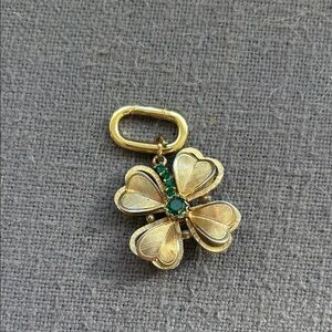 Four leaf clover pendant with a gold carabiner